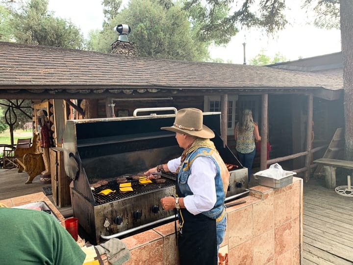 Bar Lazy's owner, Cheri, cooking burgers, salmon, steak on the outdoor grill at the Colorado ranch.