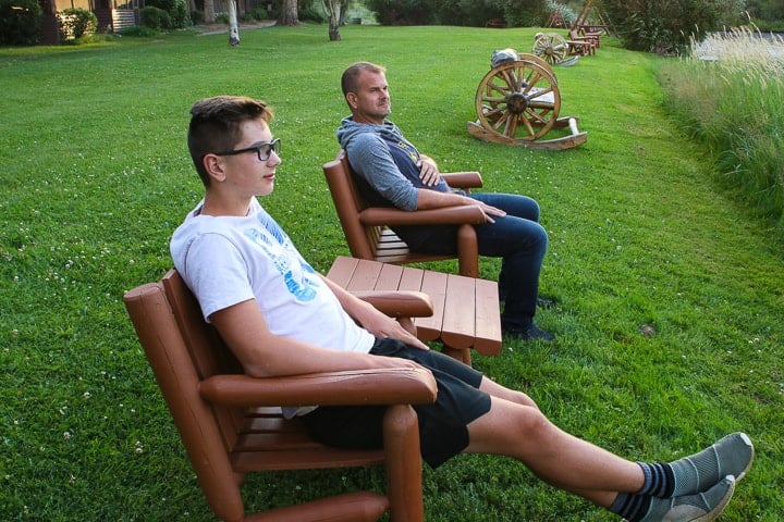 A person sitting on a bench in a park