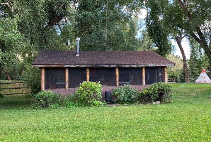 Grey Hackle, a two bedroom, two bathroom cabin being shown at a family dude ranch in Colorado.