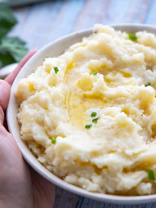 A close up mashed potatoes with butter