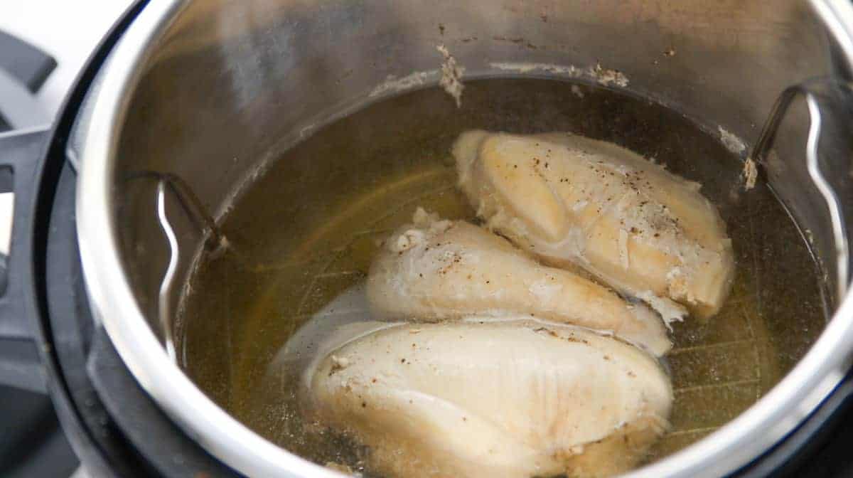 poached chicken in an instant pot after cooking.