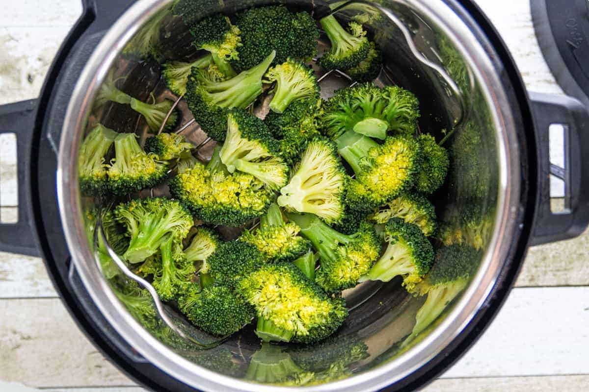 Instant Pot Broccoli showing steam broccoli in an instant pot.