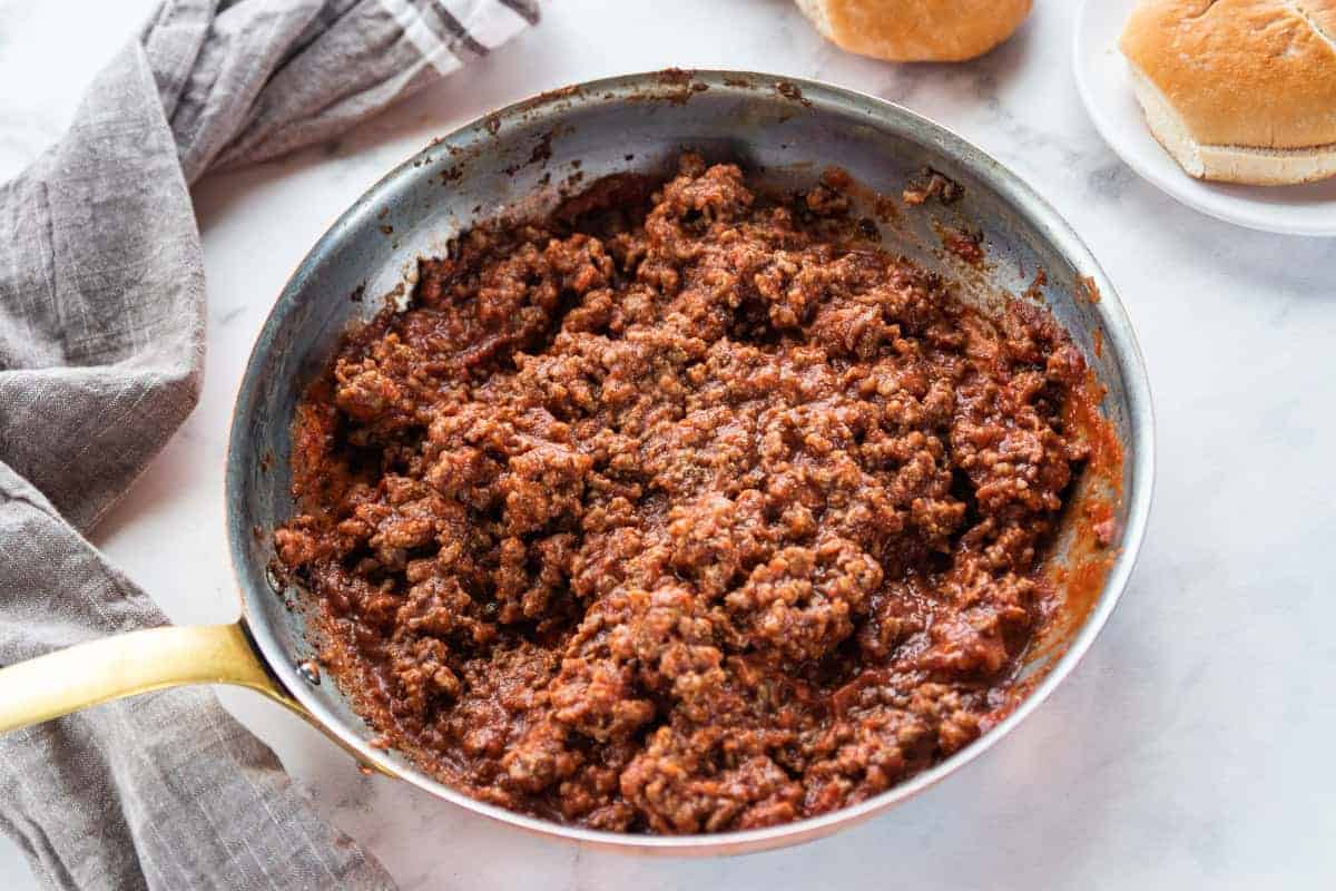 cooked sloppy Joe meat in a skillet with the mix stirred into the meat.