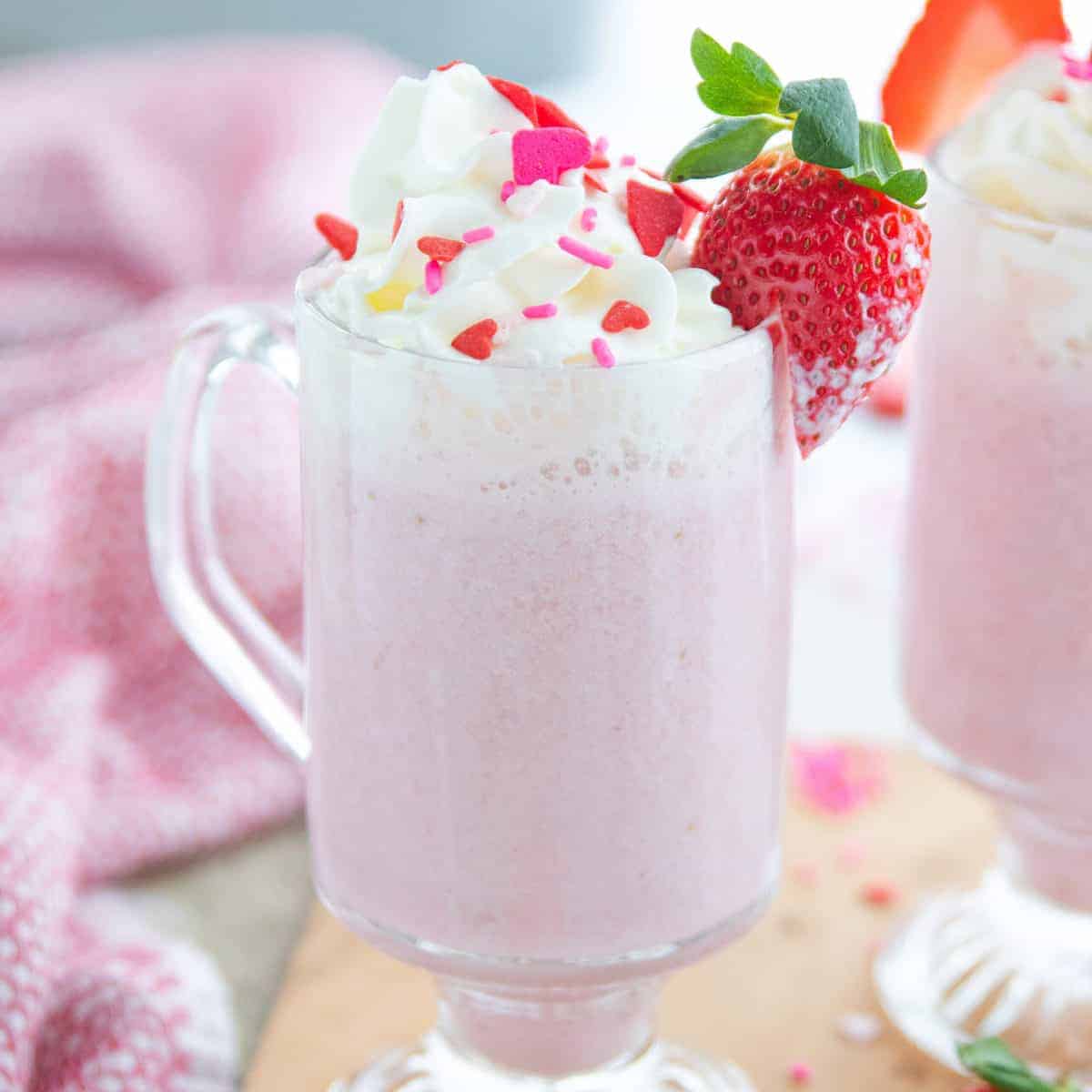 A close up of a cup of strawberry hot chocolate