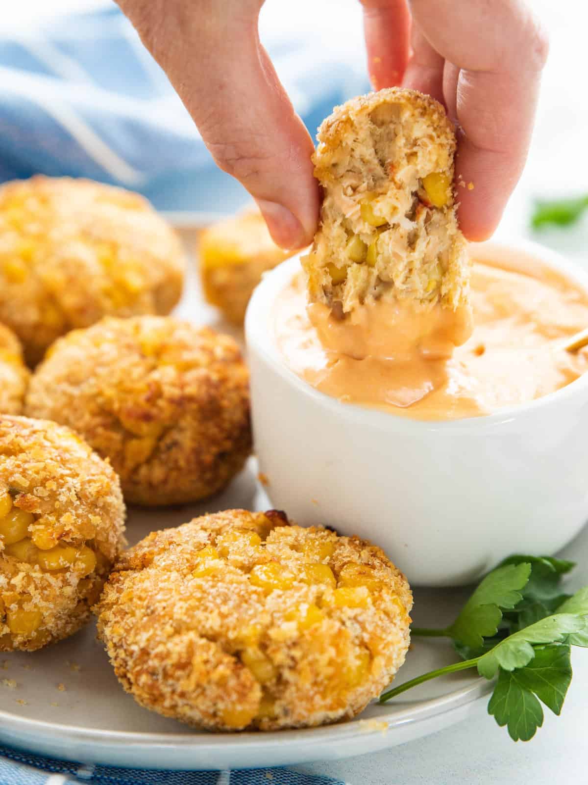 salmon Pattie dipped in sauce