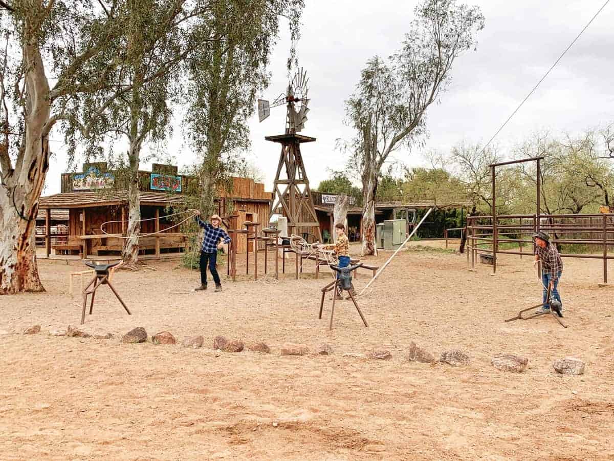 White Stallion Ranch, the Best All-Inclusive Resort in Arizona showing a family practicing their roping skills.