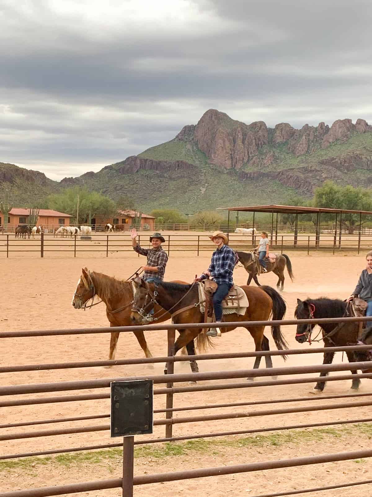 White Stallion Ranch, the Best All-Inclusive Resort in Arizona showing a family exploring the area on the ranch where Western movies were made. 