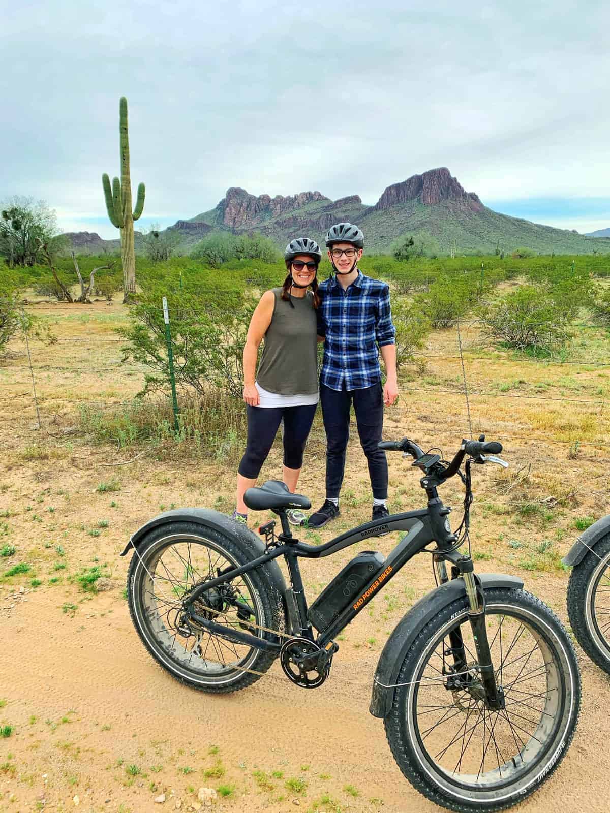 White Stallion Ranch, the Best All-Inclusive Resort in Arizona showing a mother and sun on a fat tire e-biking tour in the desert.