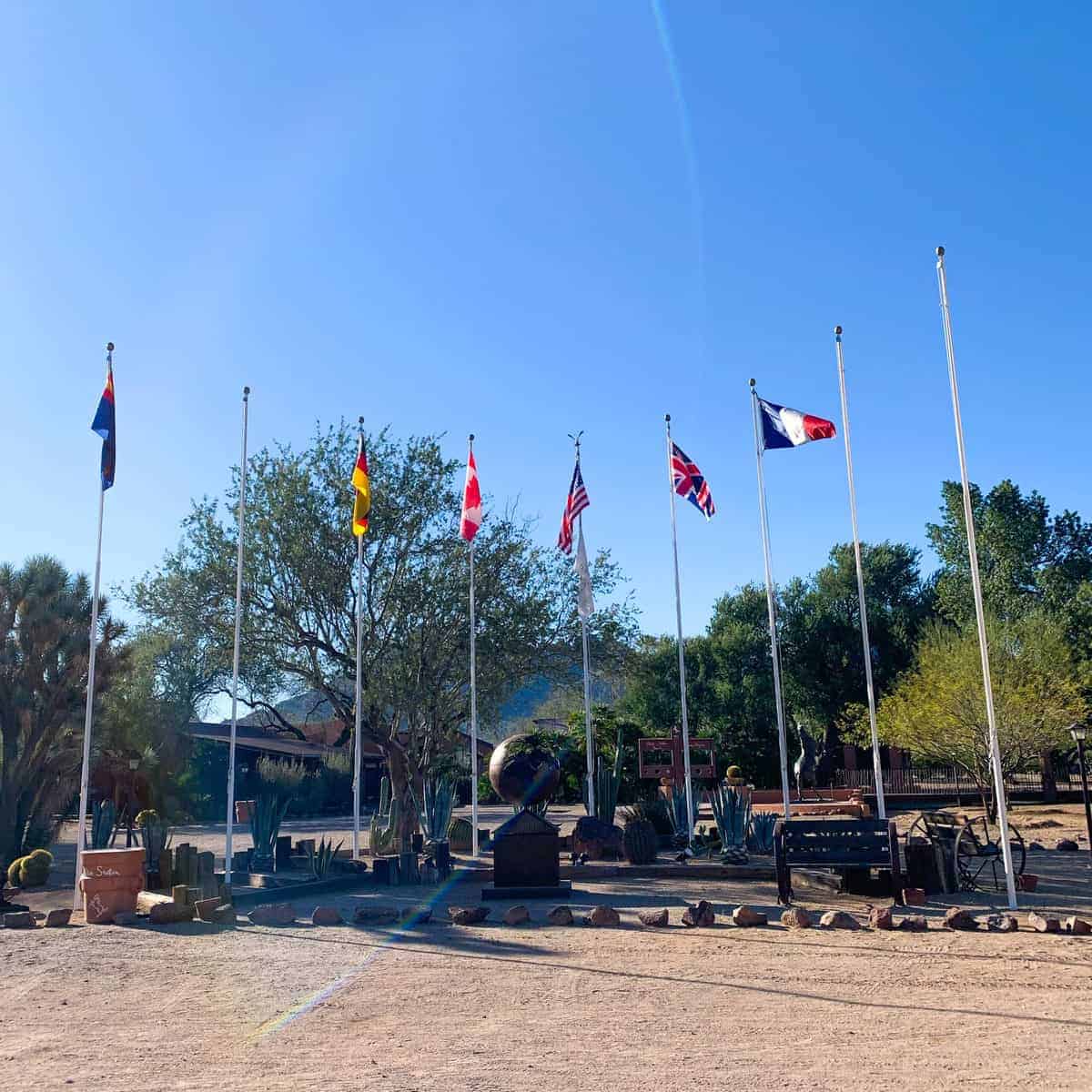 White Stallion Ranch, the Best All-Inclusive Resort in Arizona showing flags from different countries on the property of the dude ranch.