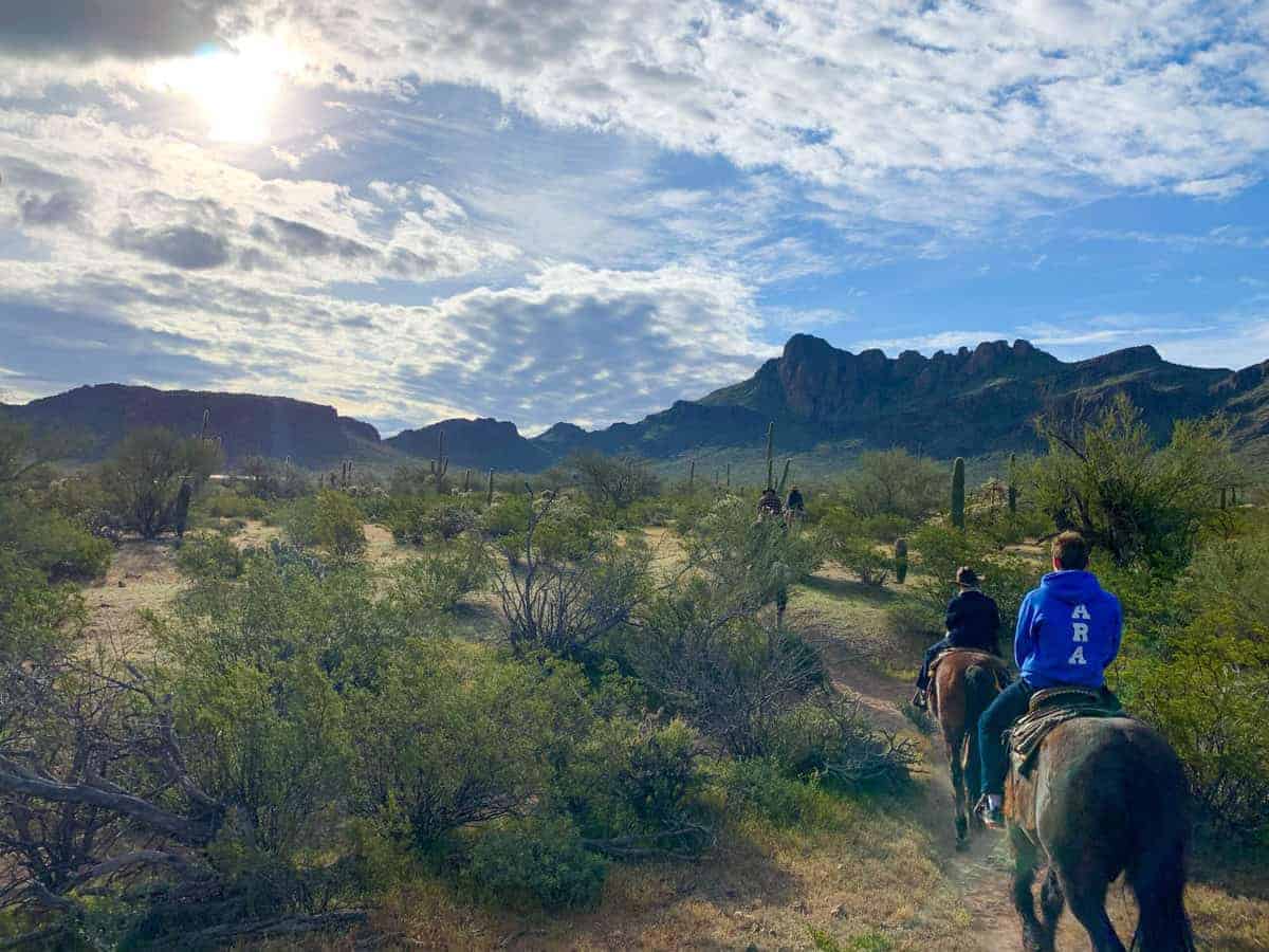 White Stallion Ranch, the Best All-Inclusive Resort in Arizona showing a family going on an afternoon ride with their horses.