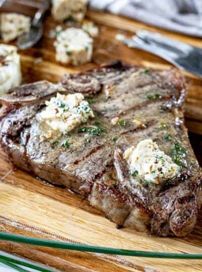 A piece of steak on a cutting board