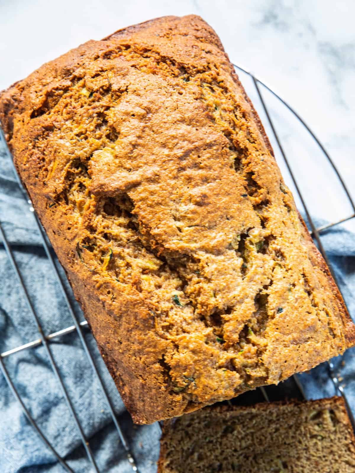 A close up of a loaf of banana zucchini bread