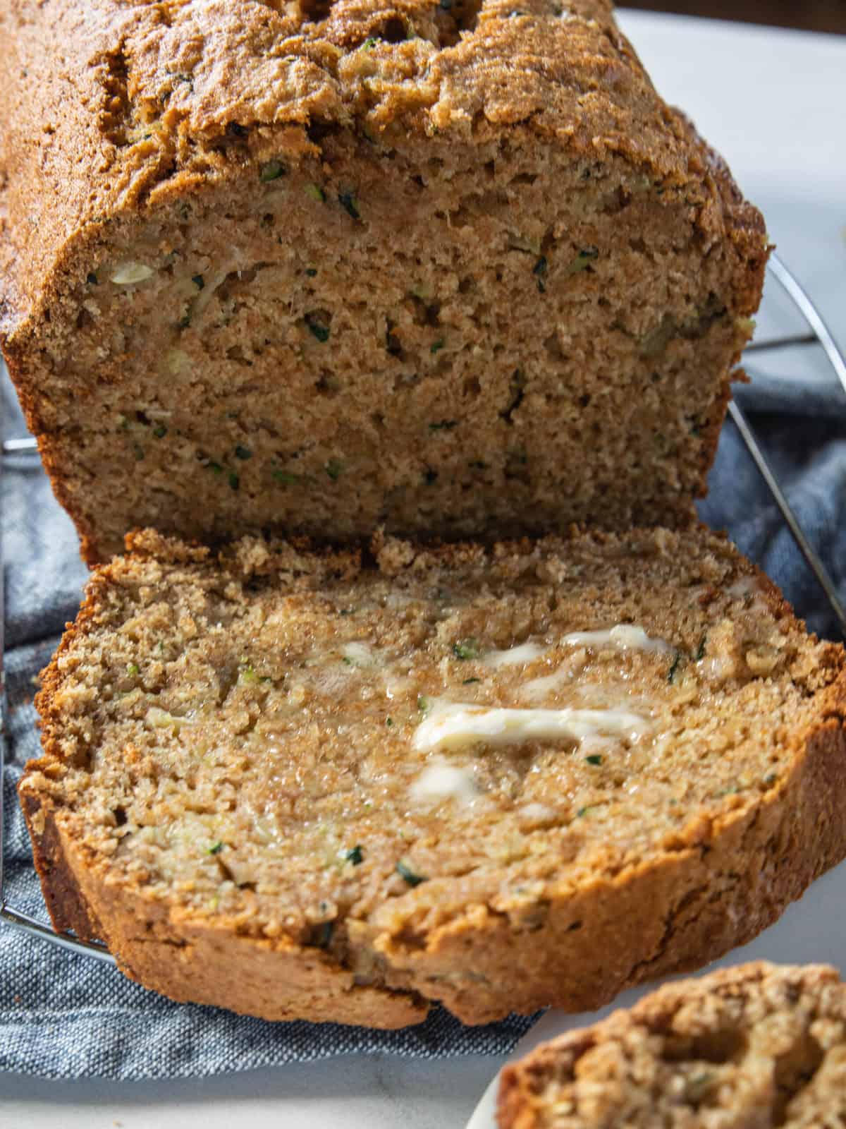 banana zucchini bread sliced with butter