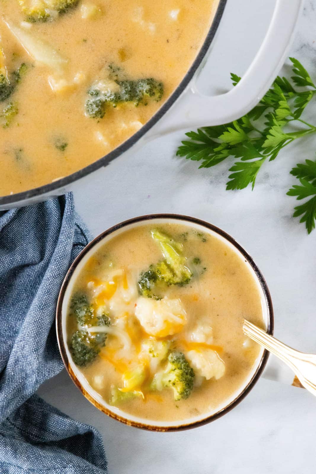 A bowl of soup with Broccoli and Cauliflower shot from above