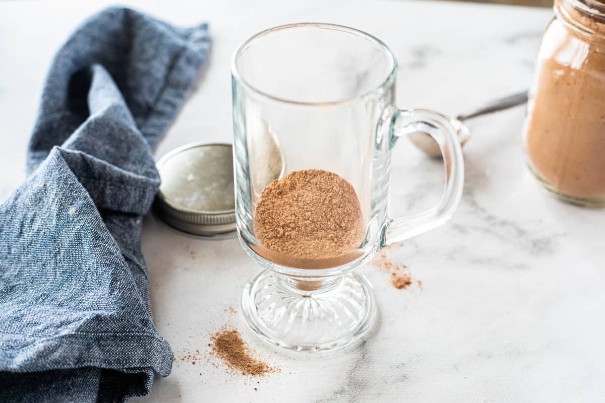 hot chocolate mix in the bottom of a glass