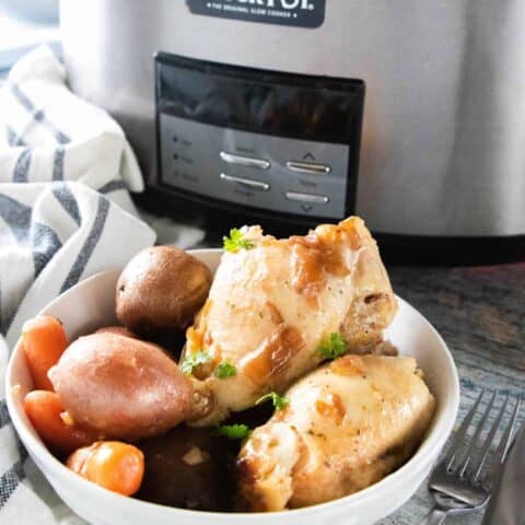 chicken thighs and vegetables in a bowl