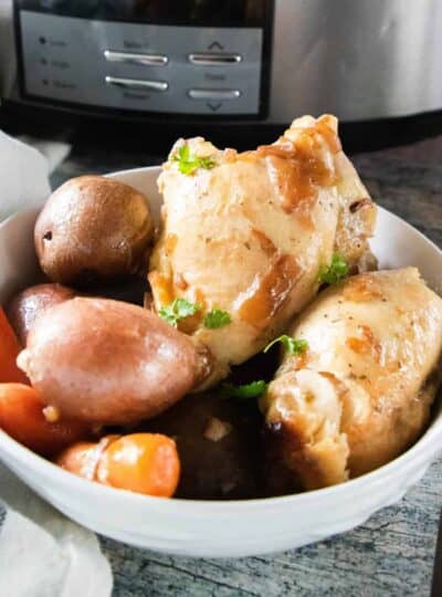 chicken thighs and vegetables in a bowl