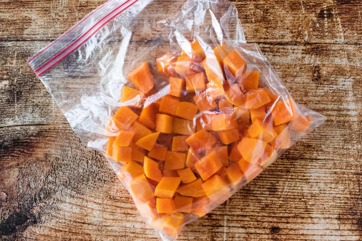 Chopped butternut squash that has been baked, cooled and placed in a ziplock bag. 