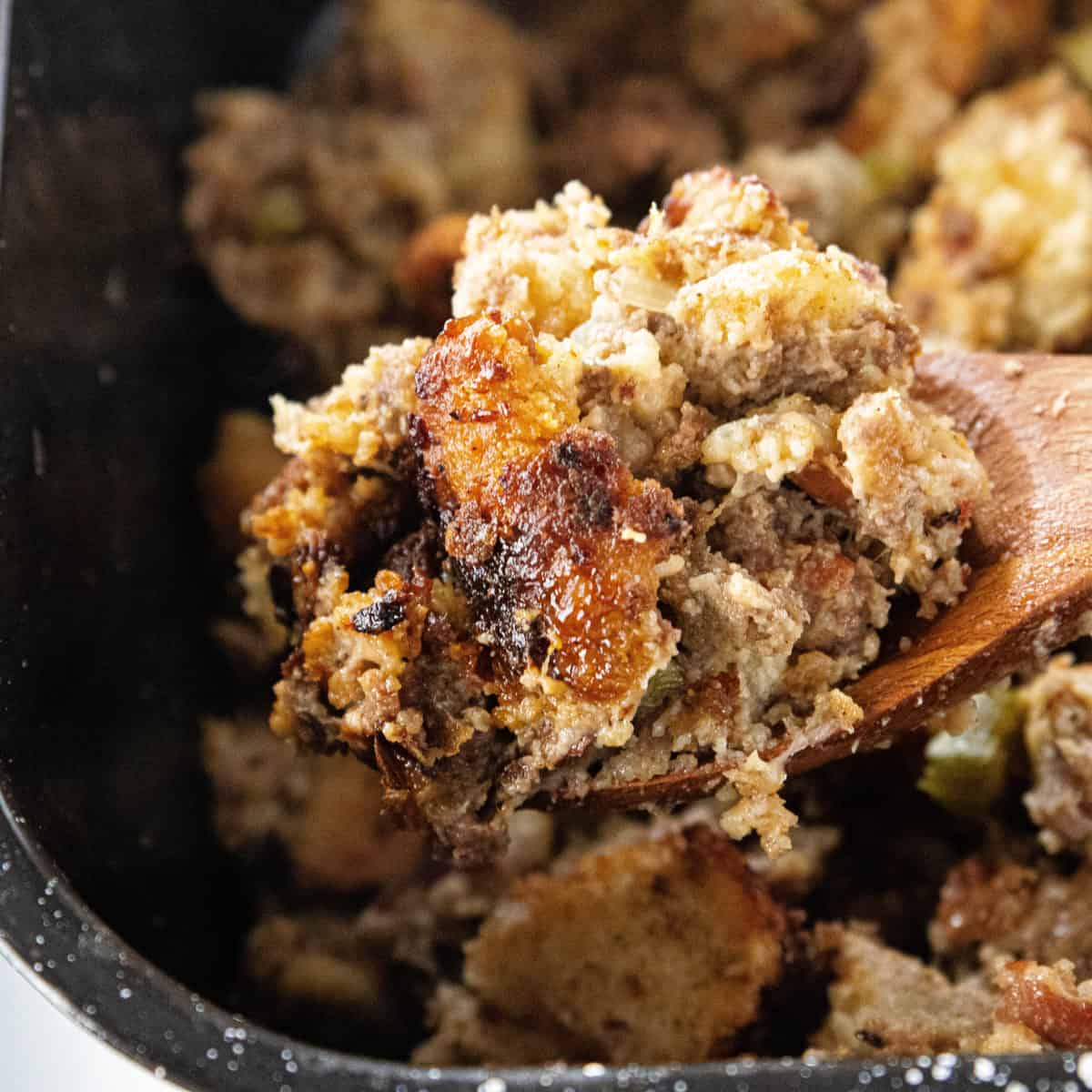 stuffing in a bowl with a wooden spoon