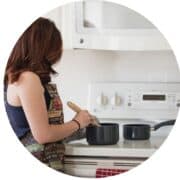 woman at stove cooking