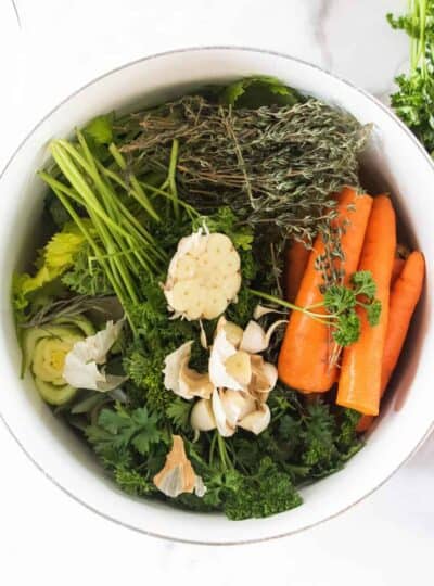 herbs and vegetables in a large stockpot