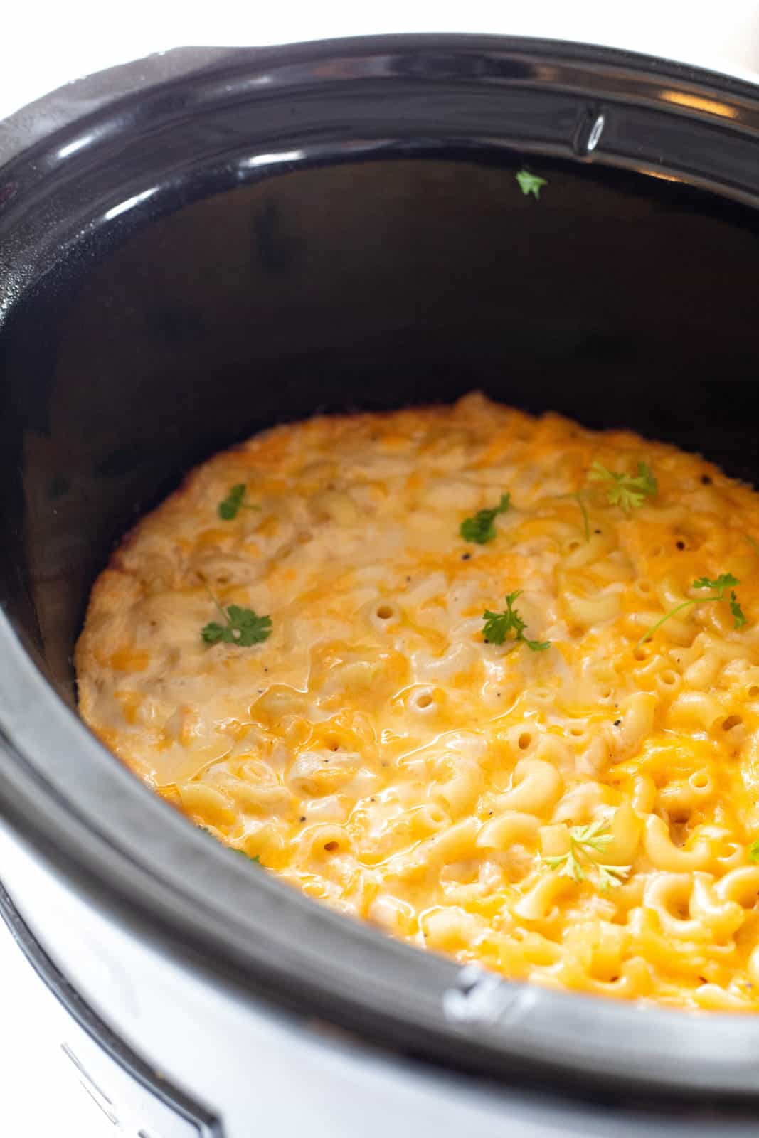 Crockpot Mac and cheese shown in the black crockpot insert.