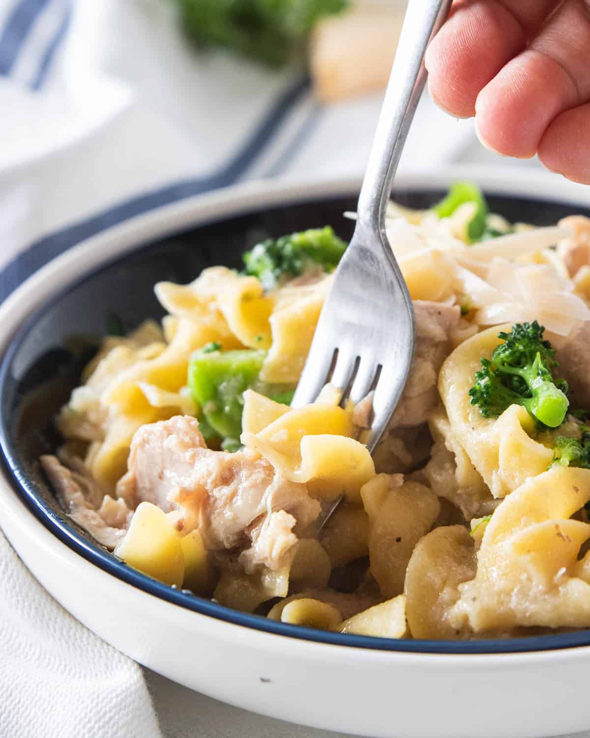 Chicken casserole in a bowl with a fork.