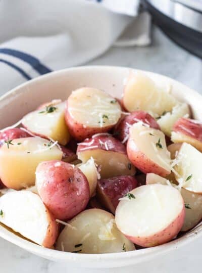 bowl of cooked red potatoes with parmesan cheese