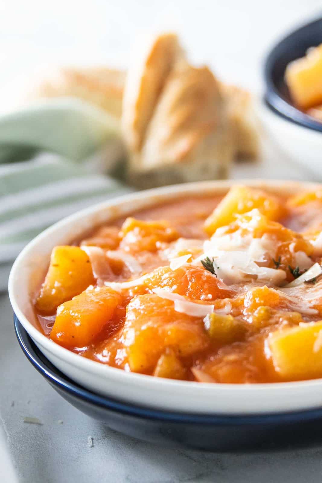 slow cooker chunky vegetable soup in a serving bowl. 