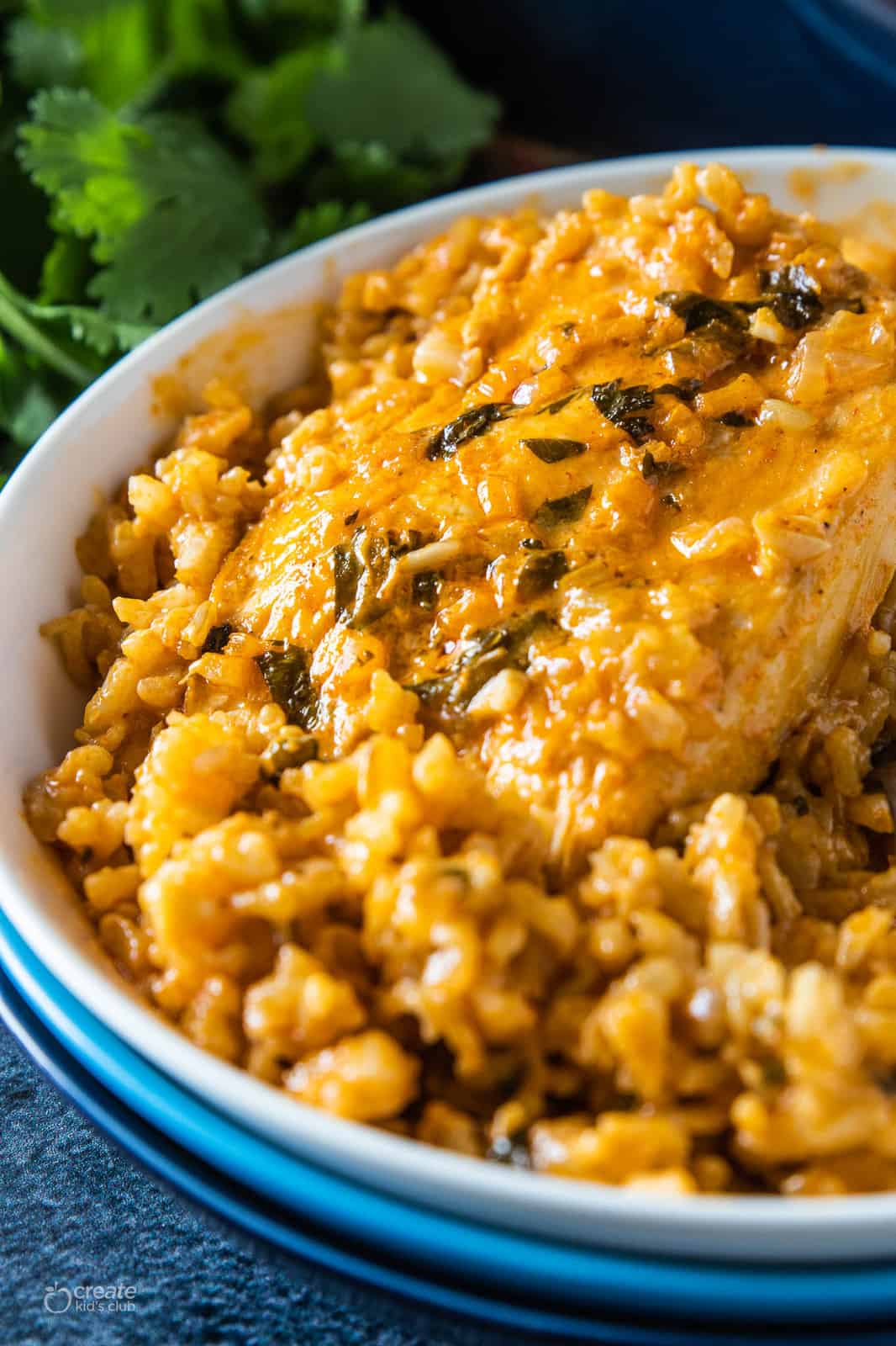 baked chicken and brown rice in a dish