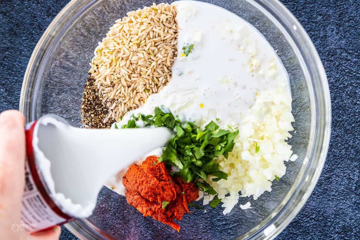 baked chicken and brown rice casserole ingredients added to a mixing bowl