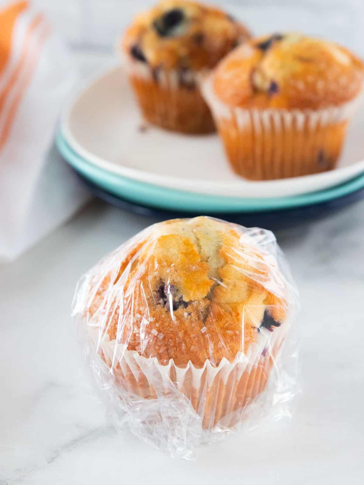 Muffin wrapped in Saran Wrap.