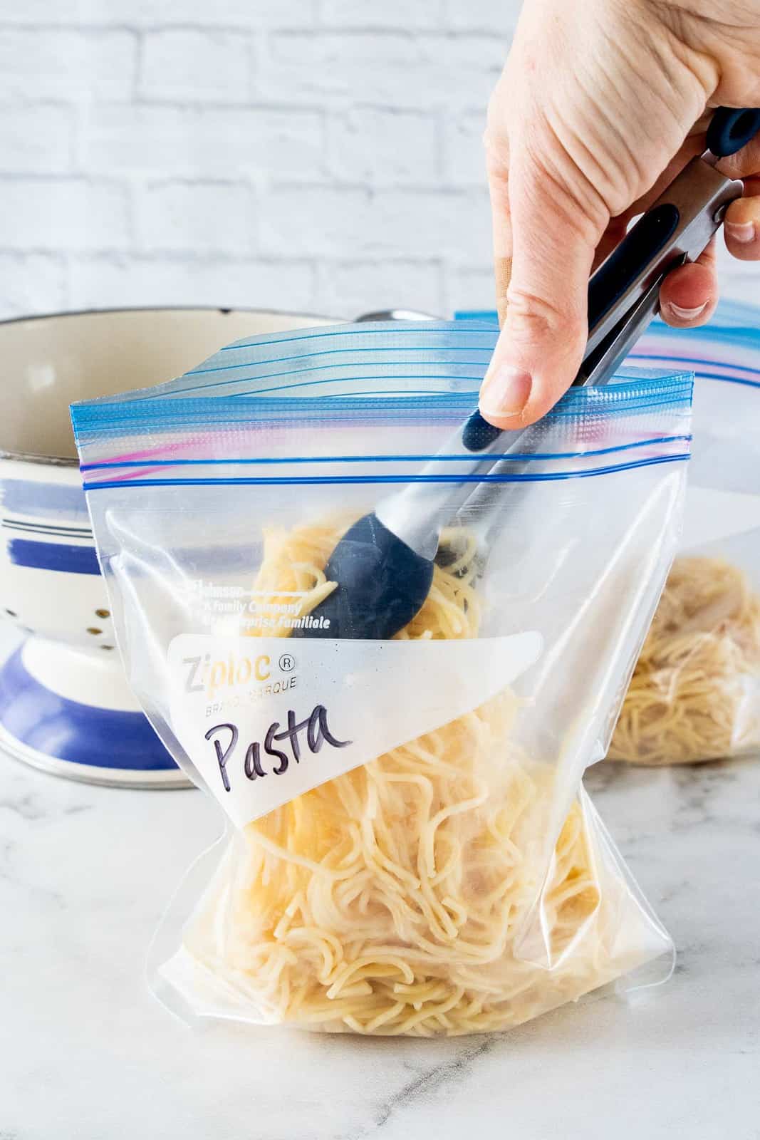 cooked pasta placed into bag.