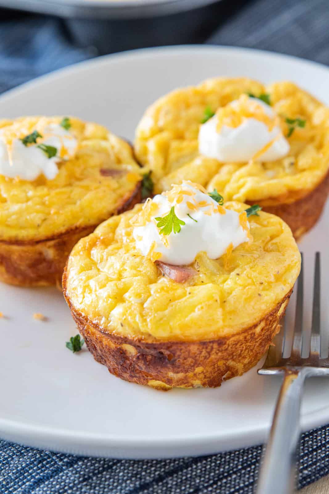 three hash brown egg cups on a plate