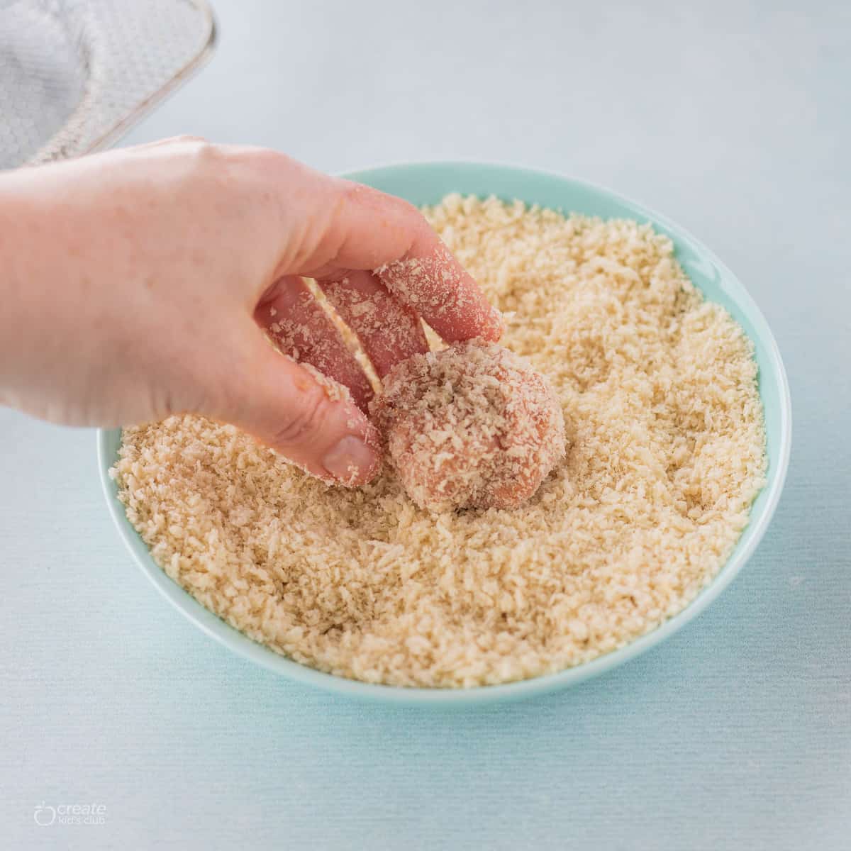 ground turkey mixture coated in breadcrumbs