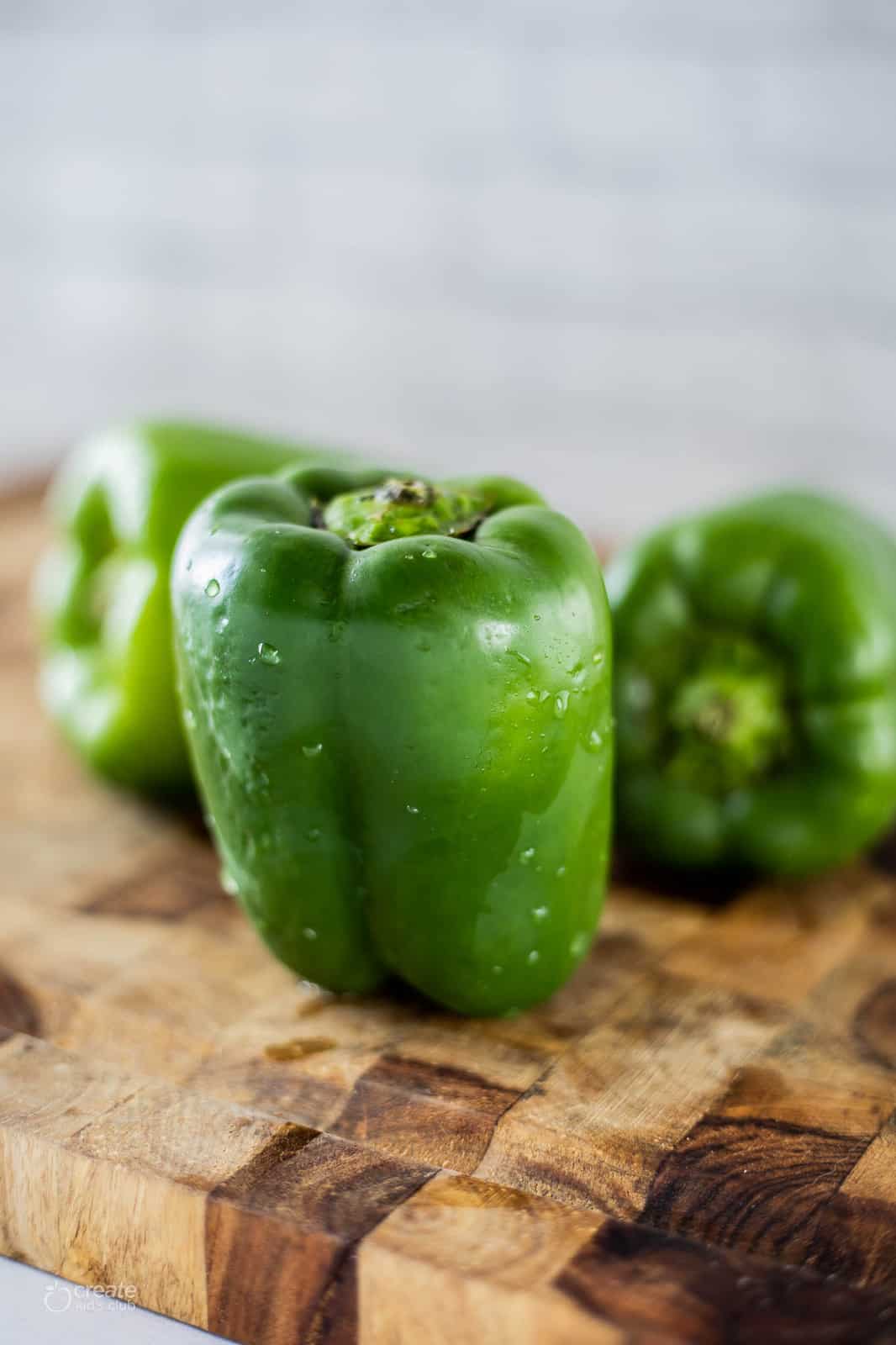 green bell peppers on cutting board