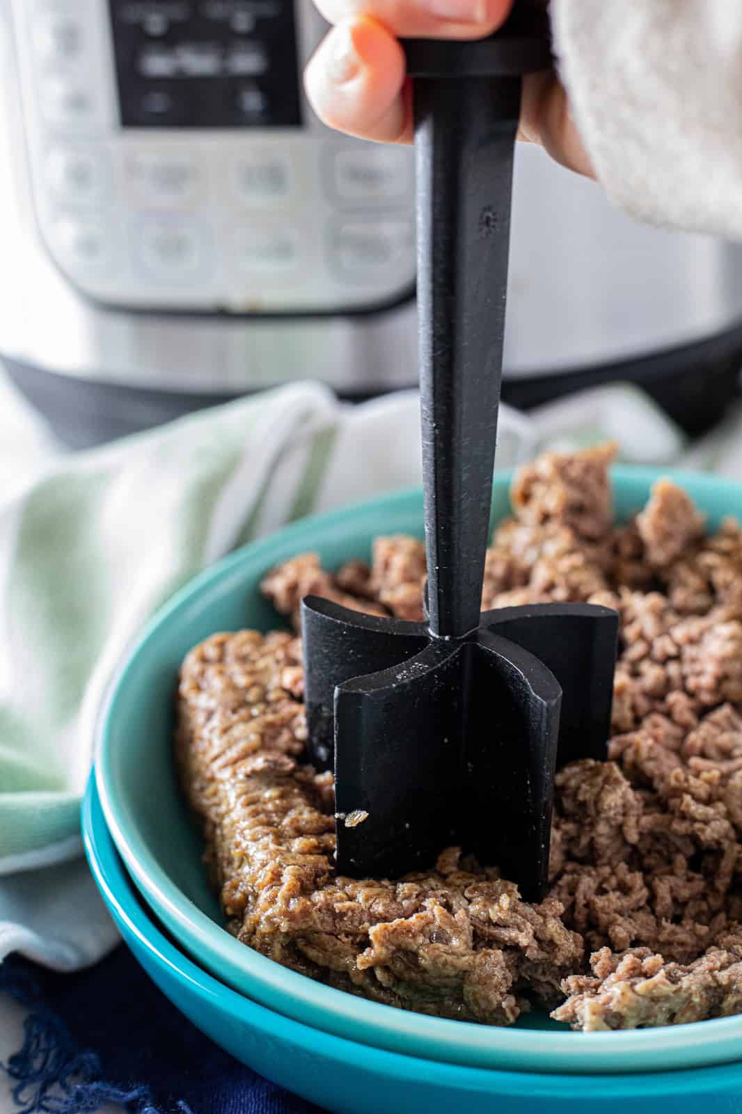 beef being ground up.