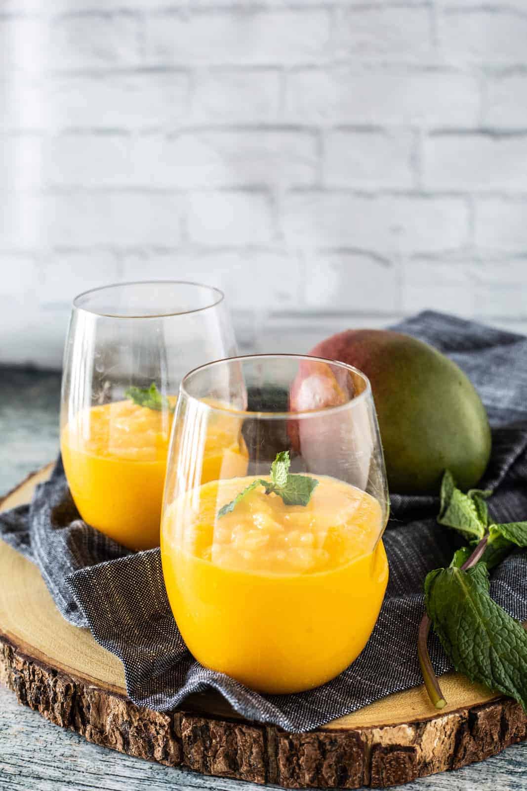 mango slushie in drinking glasses 