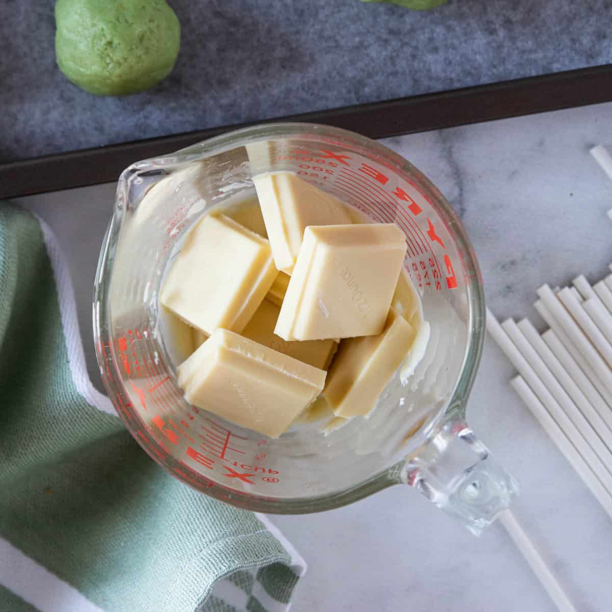 white chocolate pieces in a measuring cup