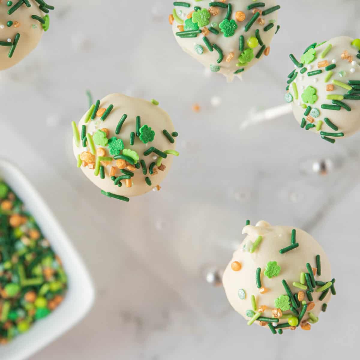 cake pops with st Patrick's day sprinkles.