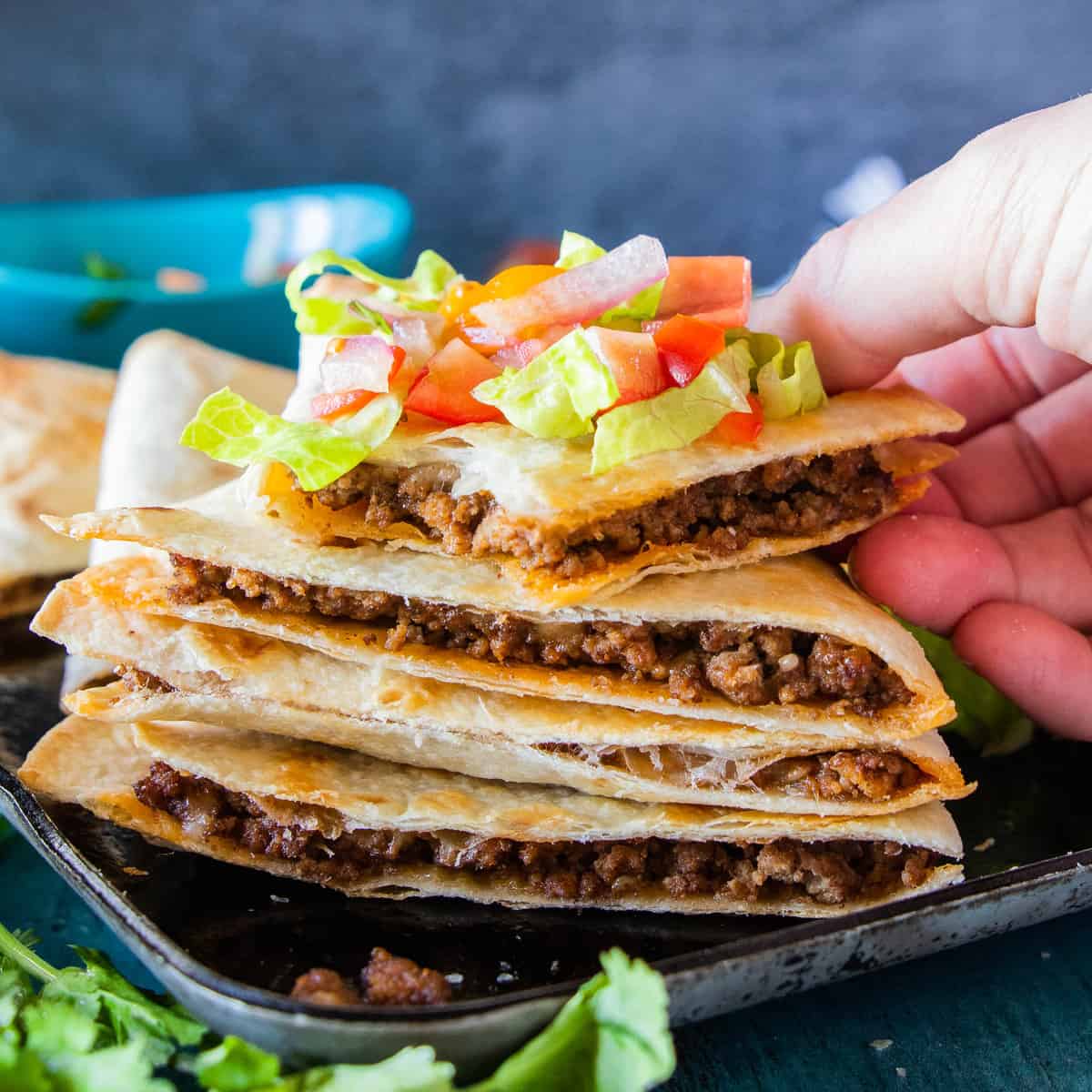 quesadillas sliced and stacked with premade salsa on top