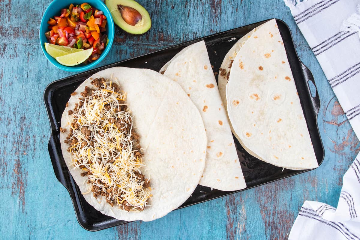 tortillas filled with ground beef and cheese