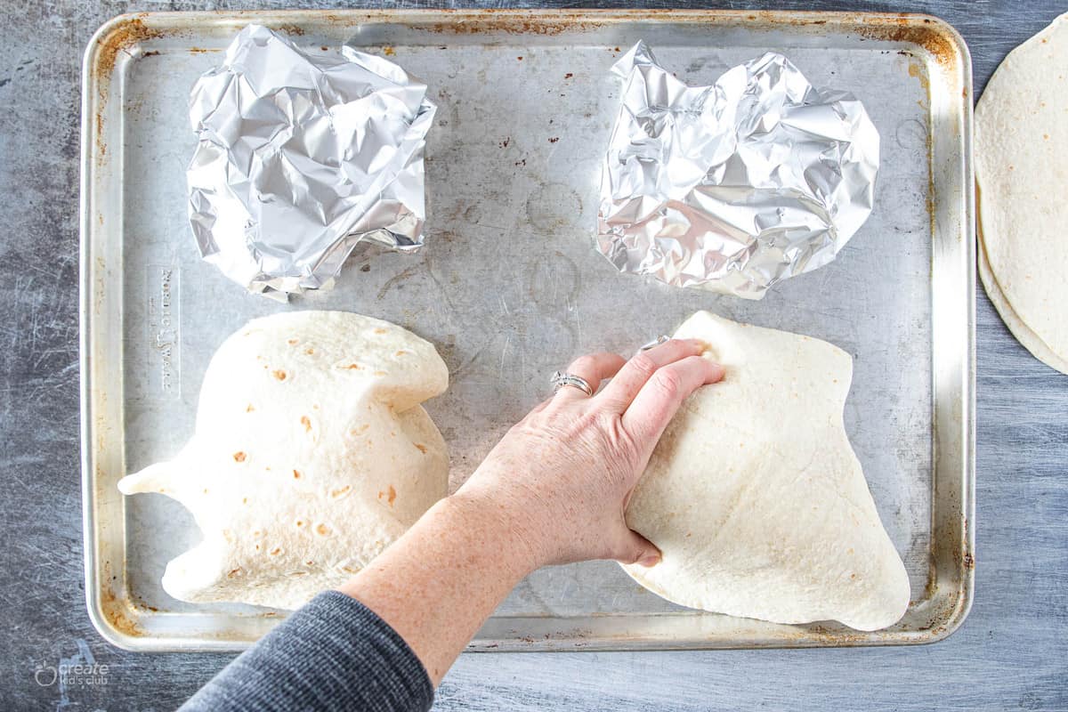 tortillas on top of crumbled foil