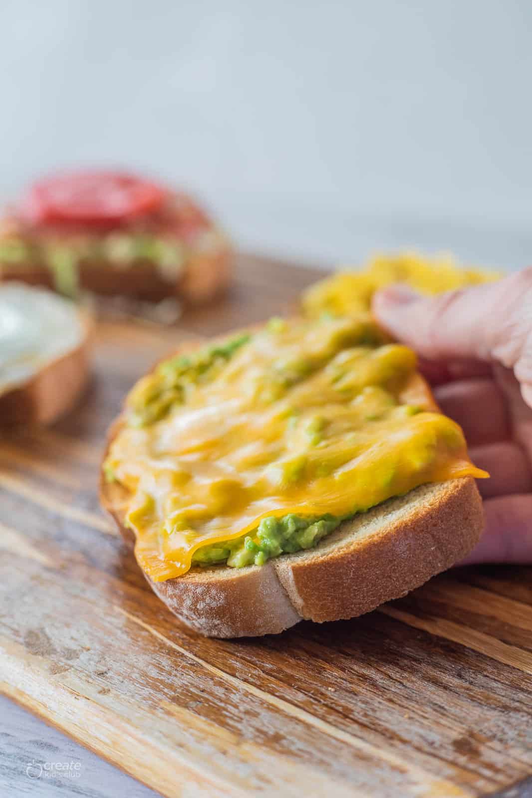 smashed avocado, cheddar cheese on toast