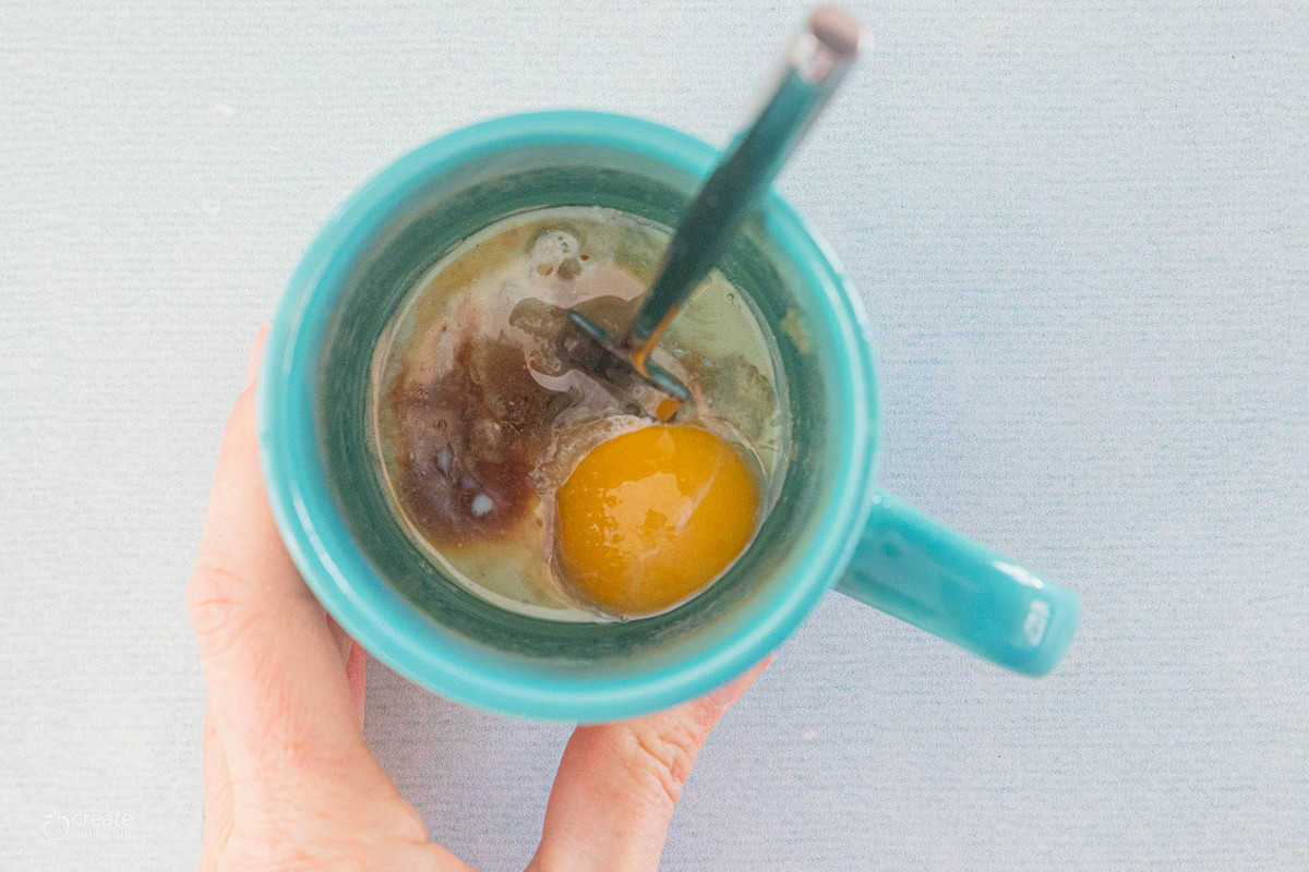 vanilla cake ingredients in a mug