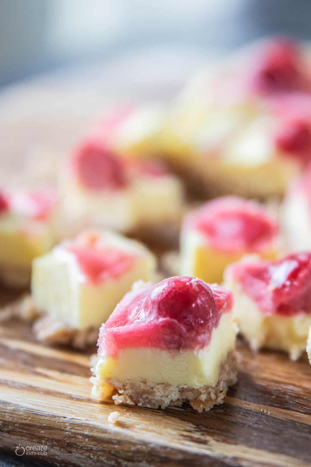 cheesecake bite with cherry pie filling on top