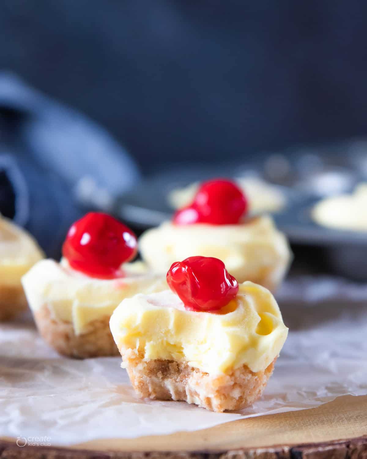 frozen cheesecake bite with a cherry on top. 