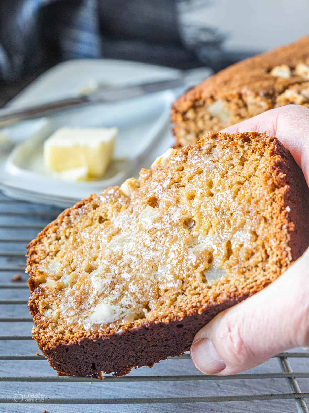 slice of apple bread spread with butter