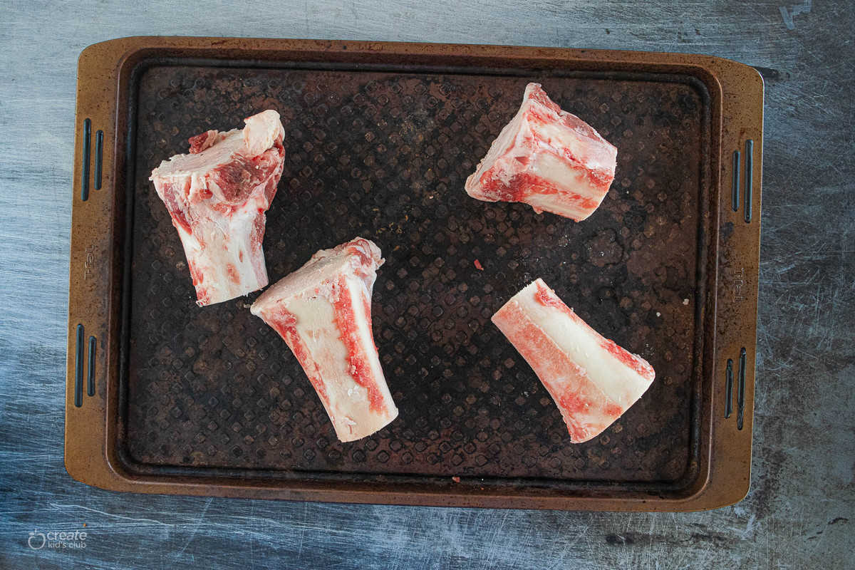 beef bones on a baking sheet
