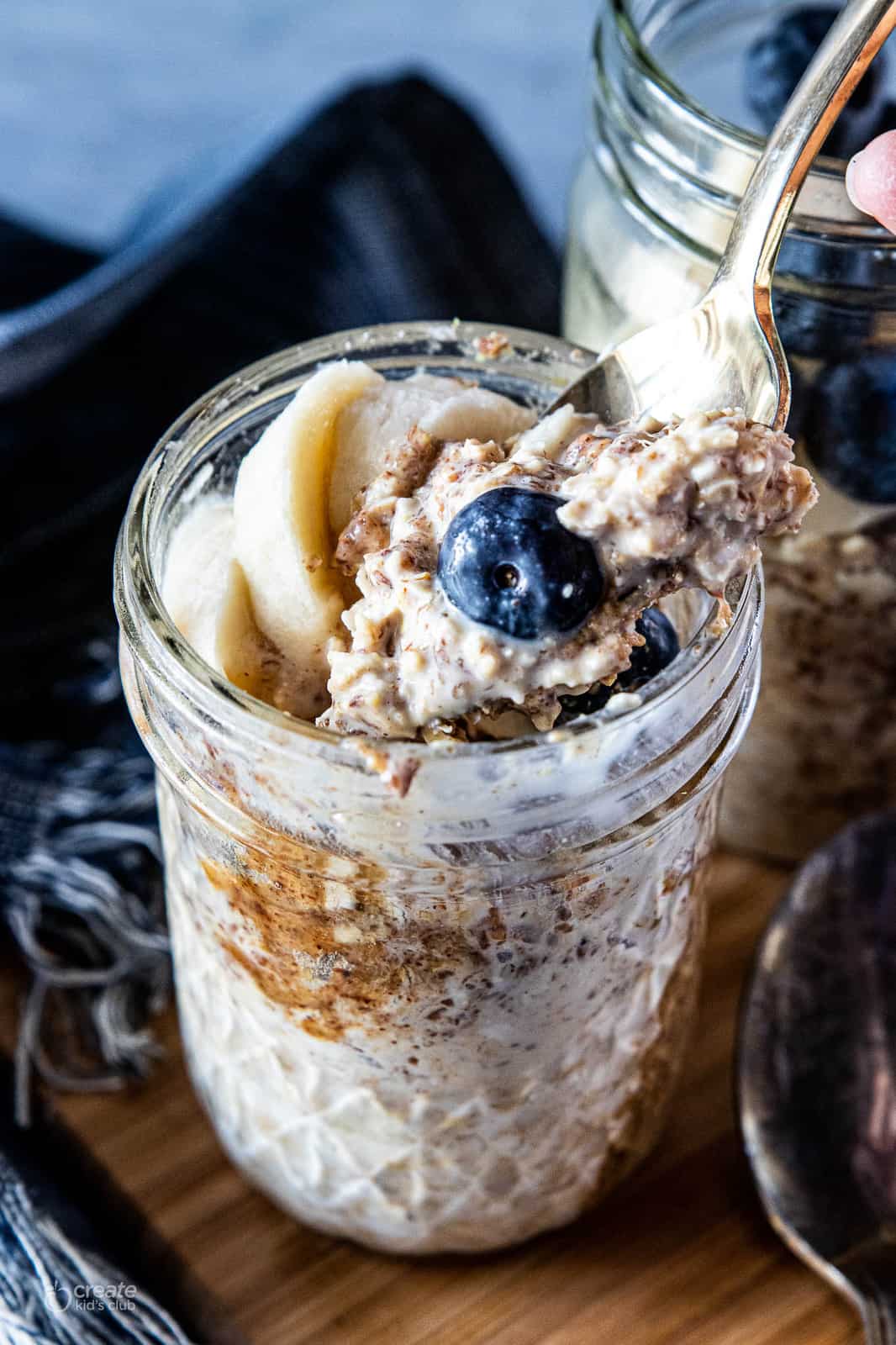 Peanut butter overnight oats in a mason jar with fresh fruit